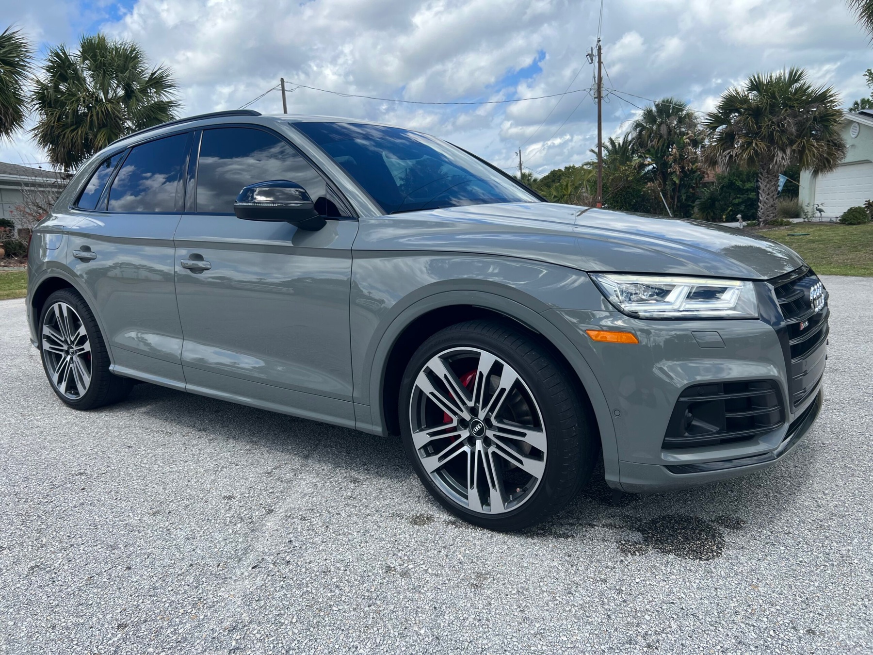 Gray Audi SQ5 with a highly reflective polished finish